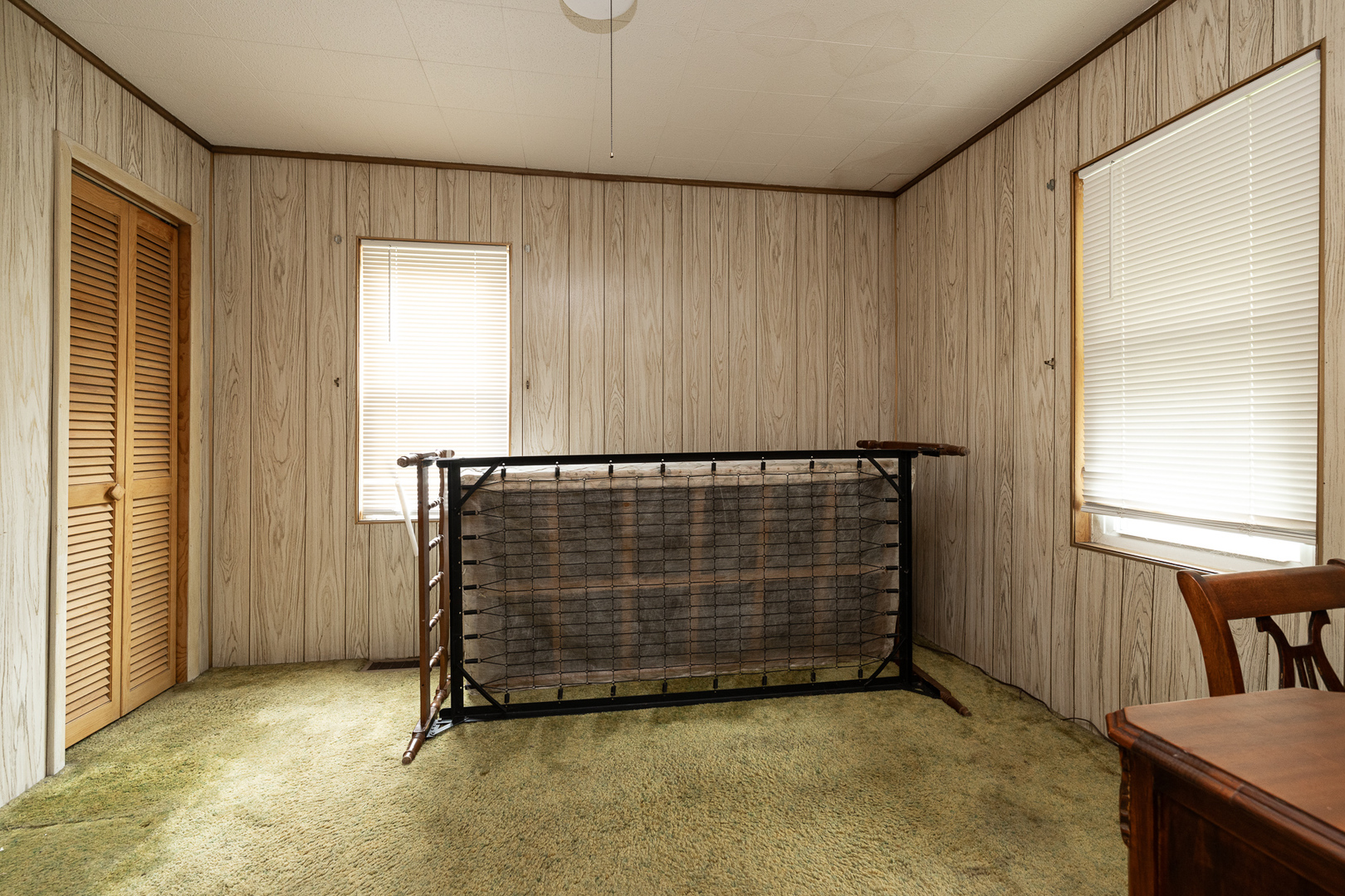 706 Clinton Street Lockport, IL 60441 - Photo 10 of 12 a view of an empty room with a window