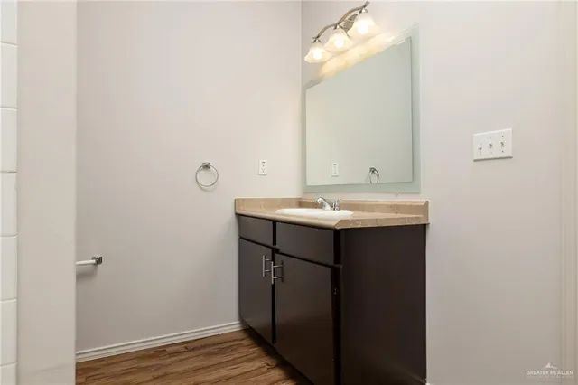 a bathroom with a sink and a mirror