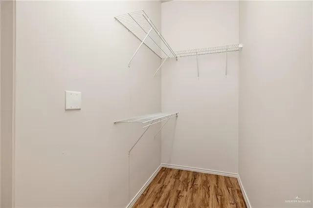 a view of a room with racks on the wall