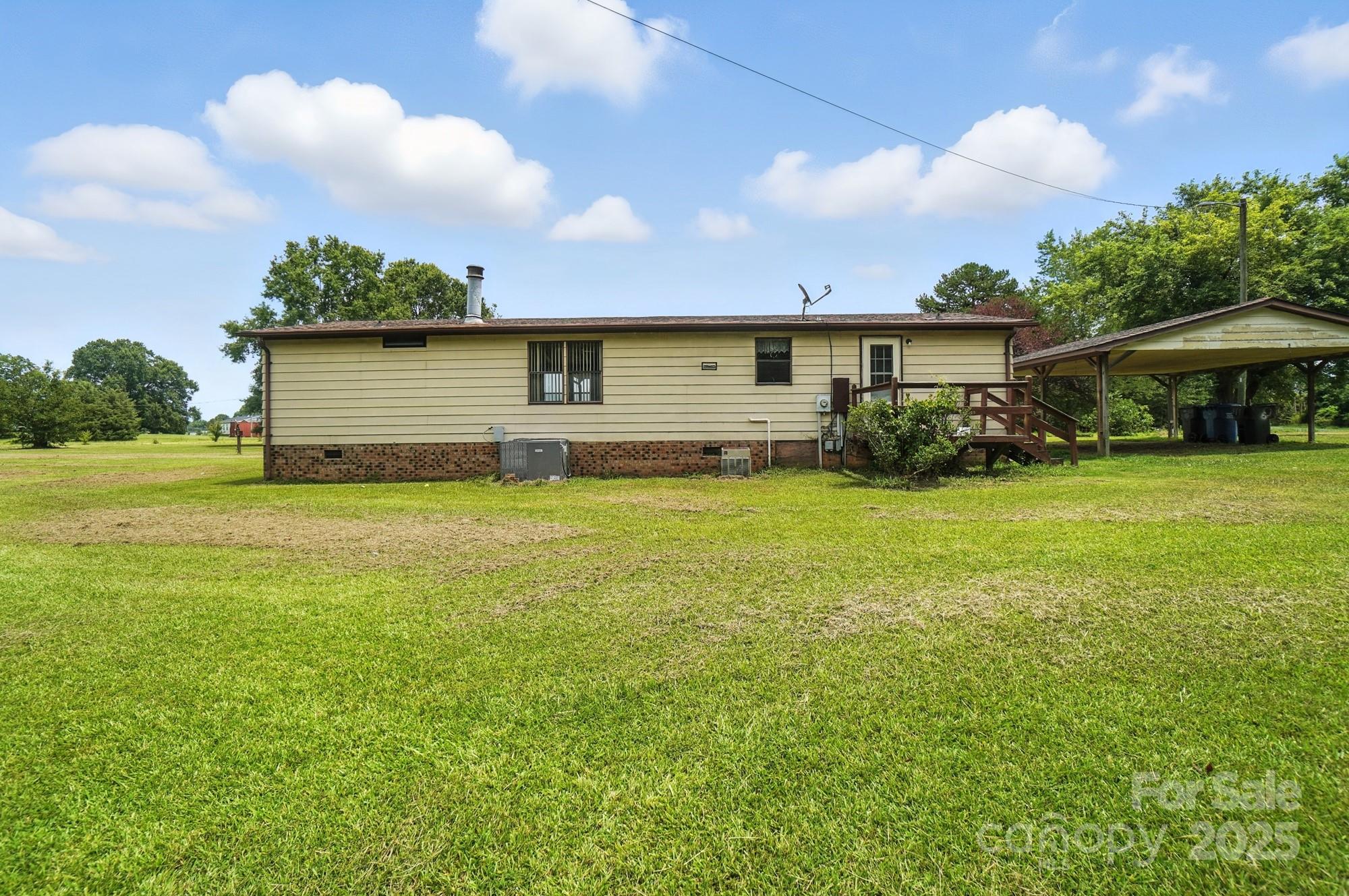 6202 Plyler Mill Road Monroe, NC 28112 - Photo 29 of 31 a house view with a garden space