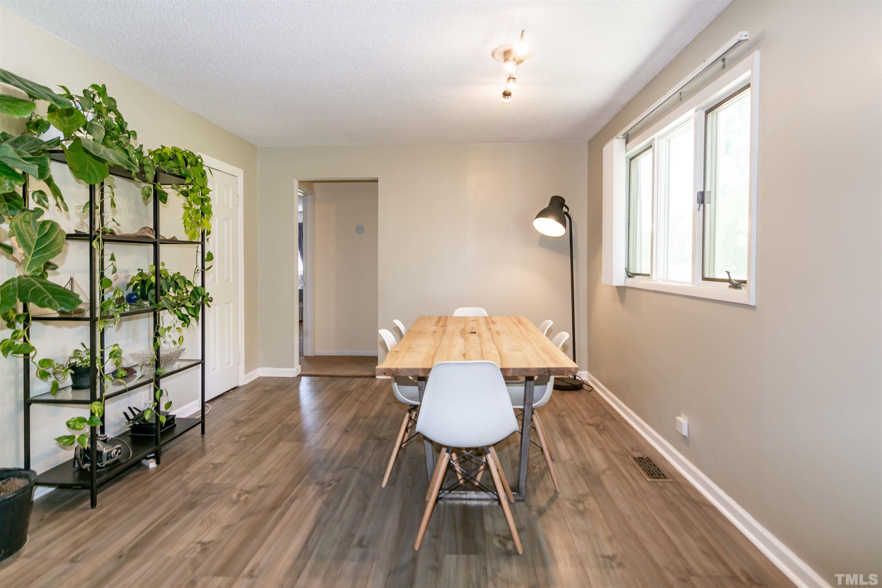 804 Stallings Road Durham, NC 27703 - Photo 19 of 37 a view of a workspace with furniture and a window