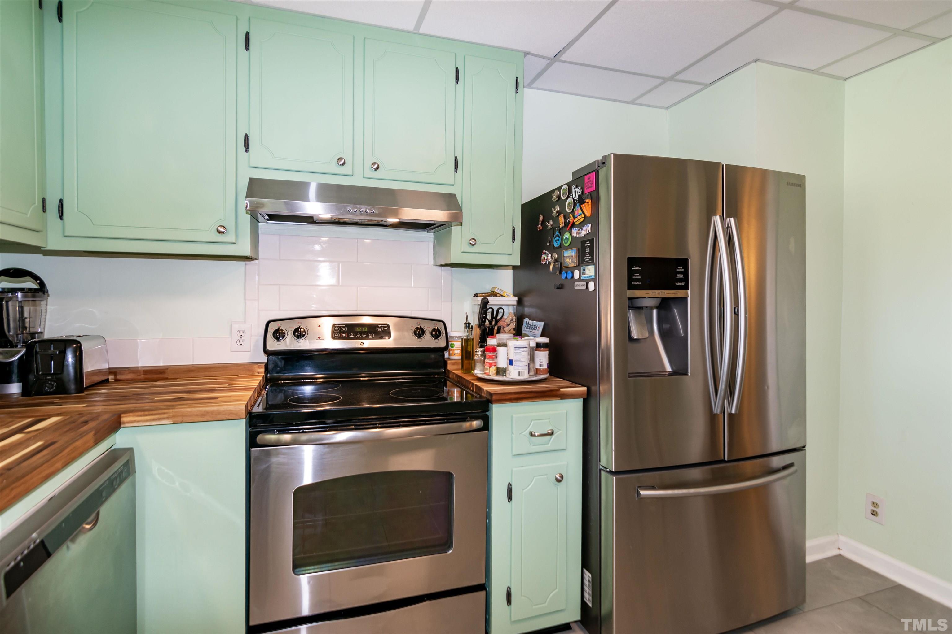 804 Stallings Road Durham, NC 27703 - Photo 25 of 37 a kitchen with appliances cabinets and a counter top space
