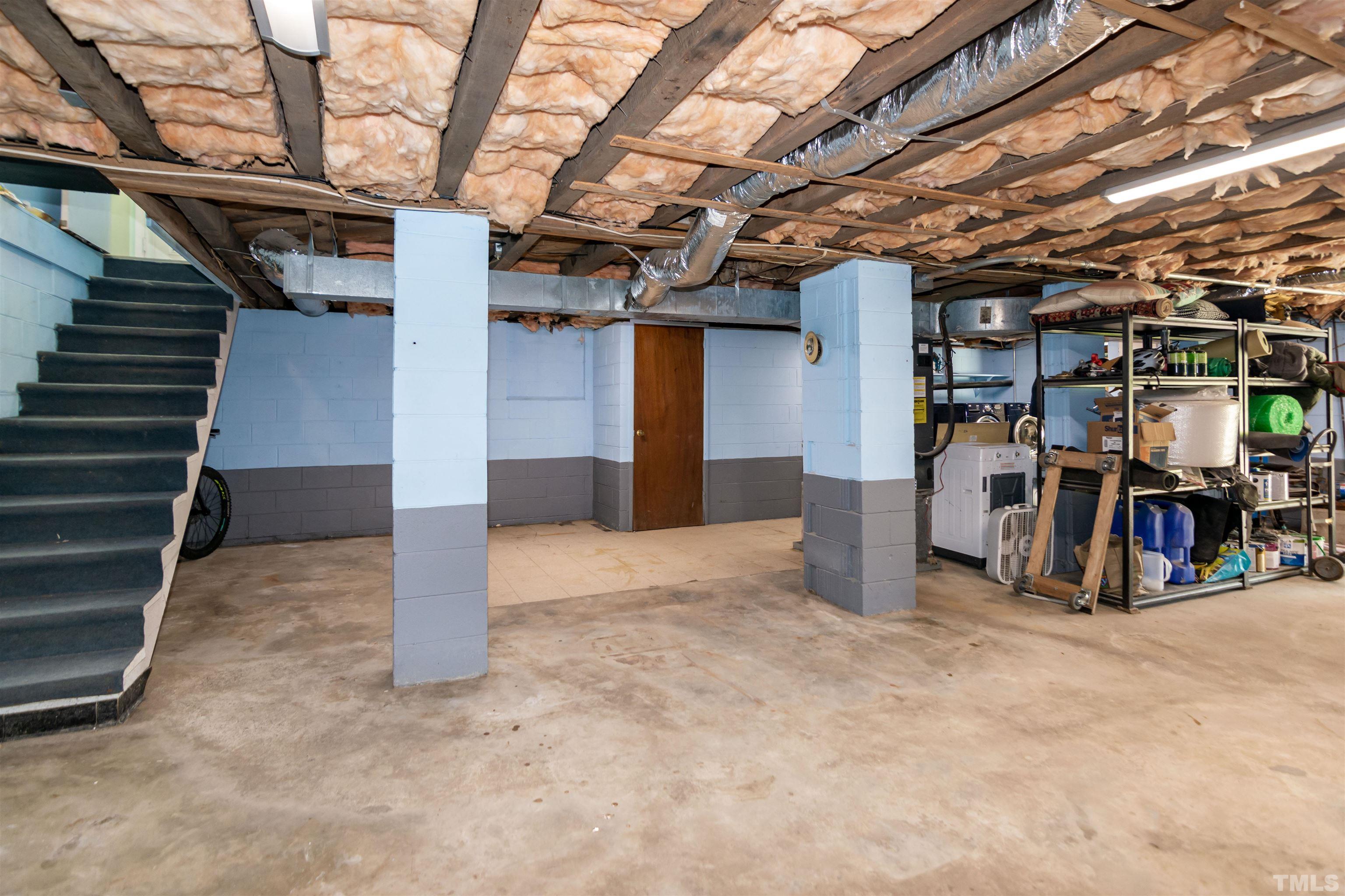 804 Stallings Road Durham, NC 27703 - Photo 28 of 37 a view of a storage room with shelves