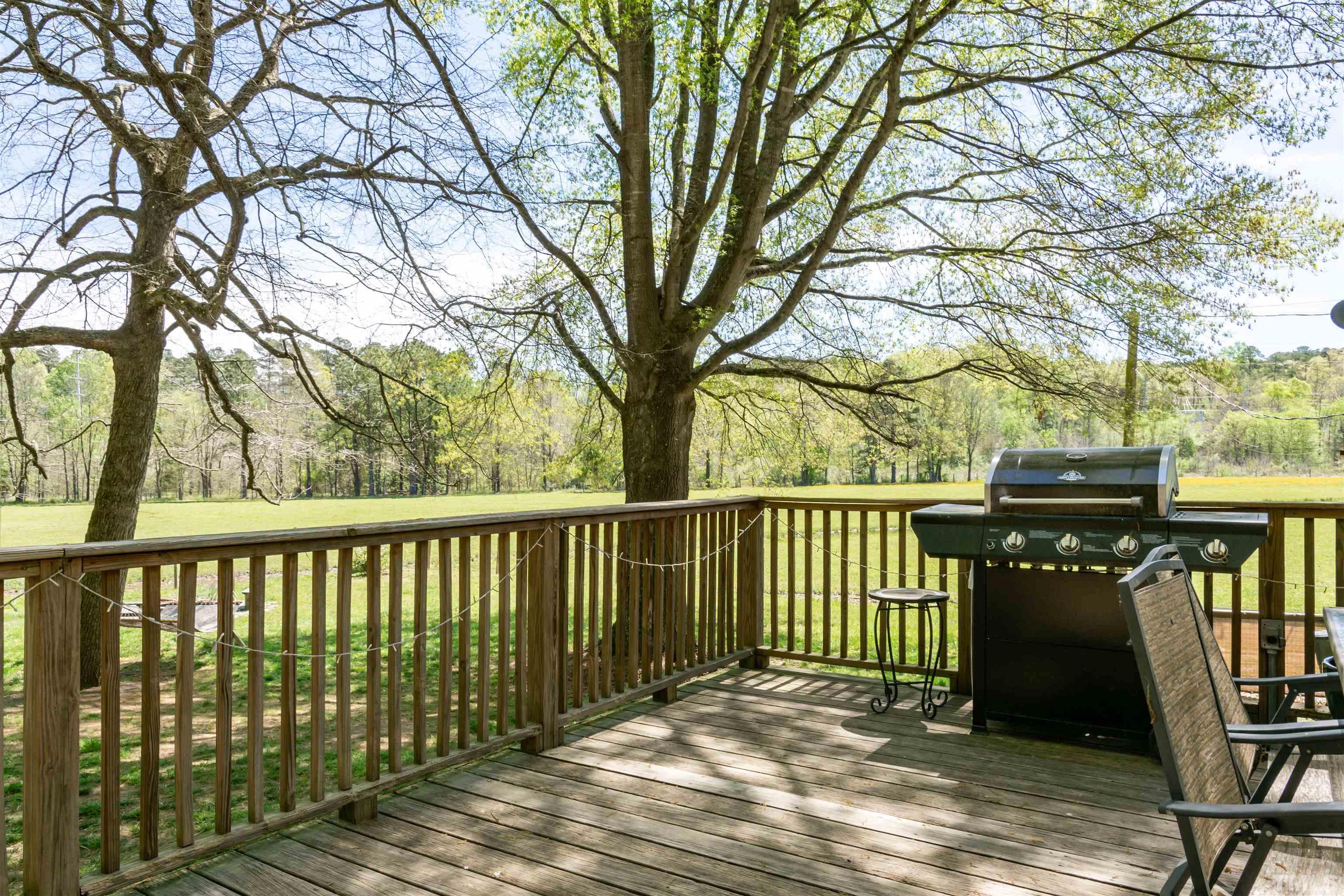 804 Stallings Road Durham, NC 27703 - Photo 10 of 37 a view of a balcony with wooden floor and fence