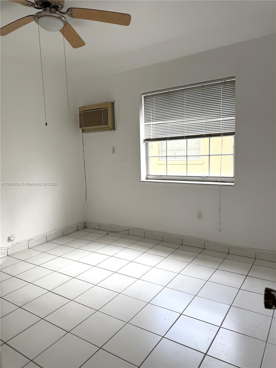 1788 Southwest 7th Street, Unit 4 Miami, FL 33135 - Photo 4 of 9 a view of an empty room and window