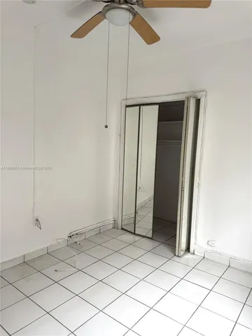 a view of a balcony with a tree