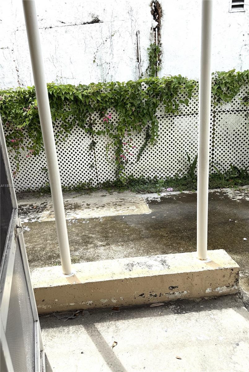 1788 Southwest 7th Street, Unit 4 Miami, FL 33135 - Photo 6 of 9 a view of a balcony with a tree