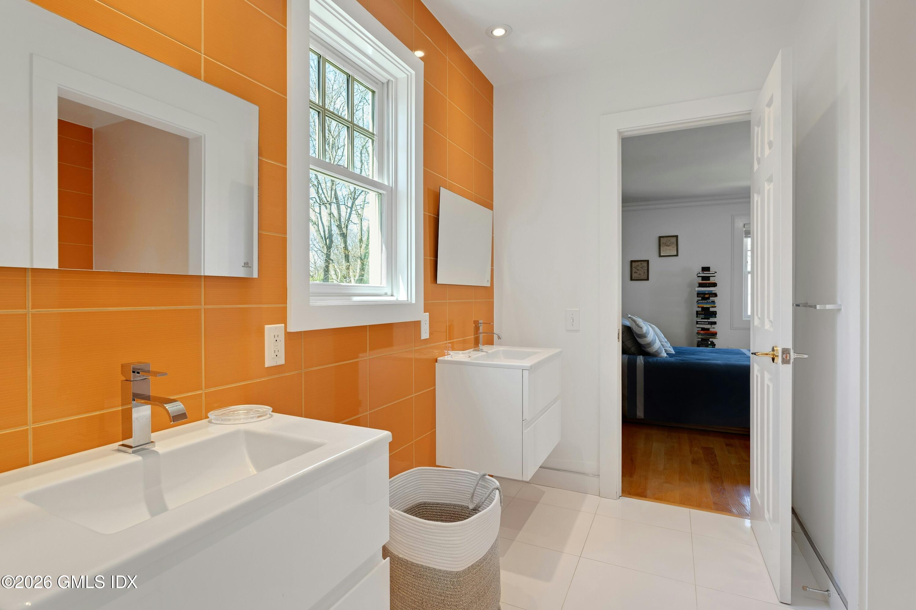 16 Summit Road Riverside, CT 06878 - Photo 22 of 34 a bathroom with a sink and a bathtub
