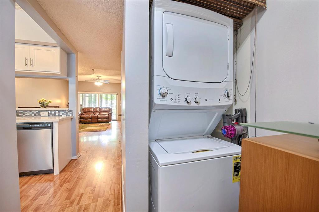 154 Southwest 96th Terrace Plantation, FL 33324 - Photo 12 of 12 a view of washer and dryer with kitchen view
