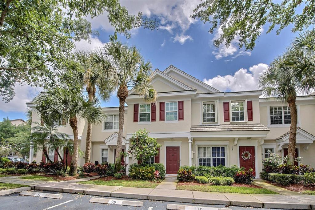 154 Southwest 96th Terrace Plantation, FL 33324 - Photo 2 of 12 a front view of a house with a garden
