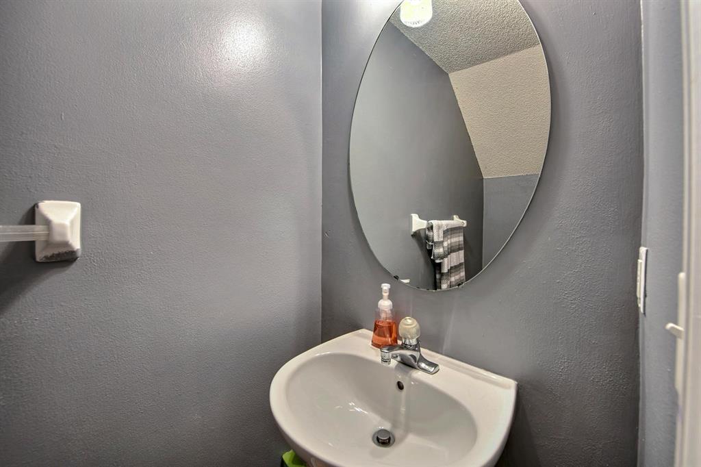 154 Southwest 96th Terrace Plantation, FL 33324 - Photo 7 of 12 a bathroom with a sink and mirror