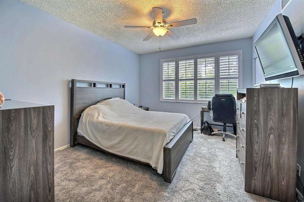 154 Southwest 96th Terrace Plantation, FL 33324 - Photo 8 of 12 a bedroom with a bed dresser and a window