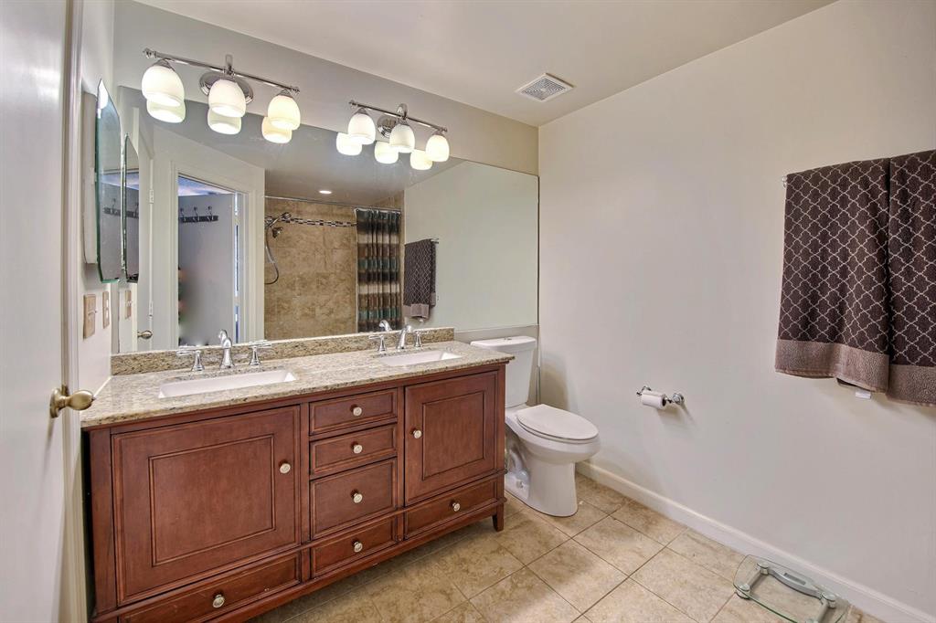 154 Southwest 96th Terrace Plantation, FL 33324 - Photo 10 of 12 a bathroom with a double vanity sink and a toilet