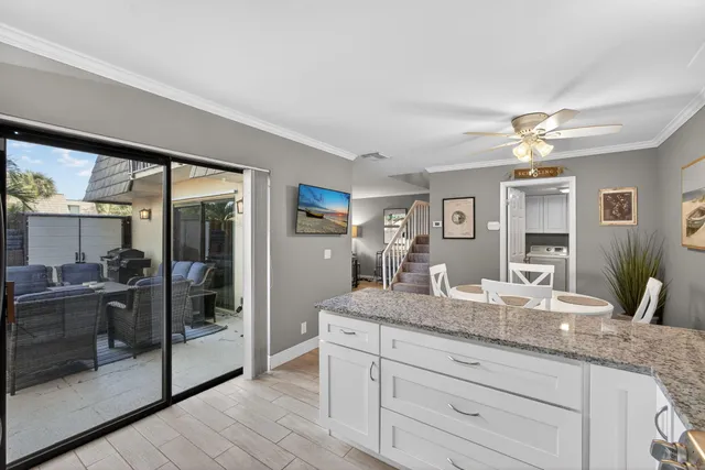 a view of a livingroom with furniture and hardwood floor