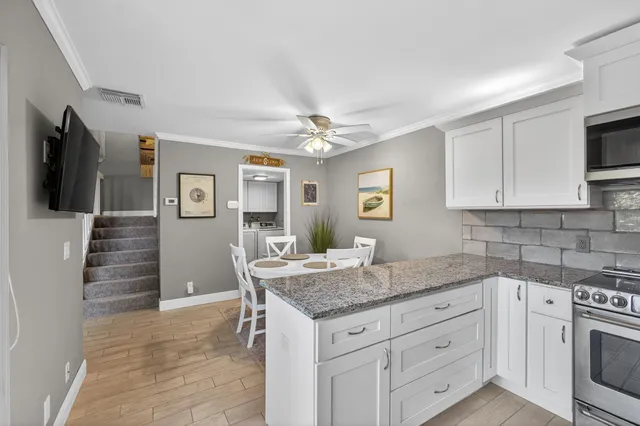 a view of entryway with stairs and wooden floor