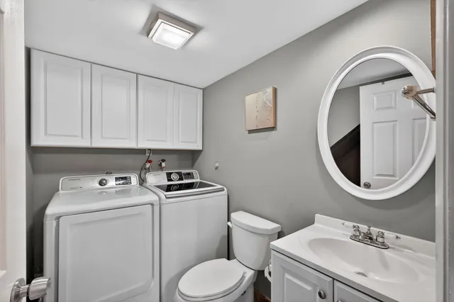 a bathroom with a shower a toilet and sink