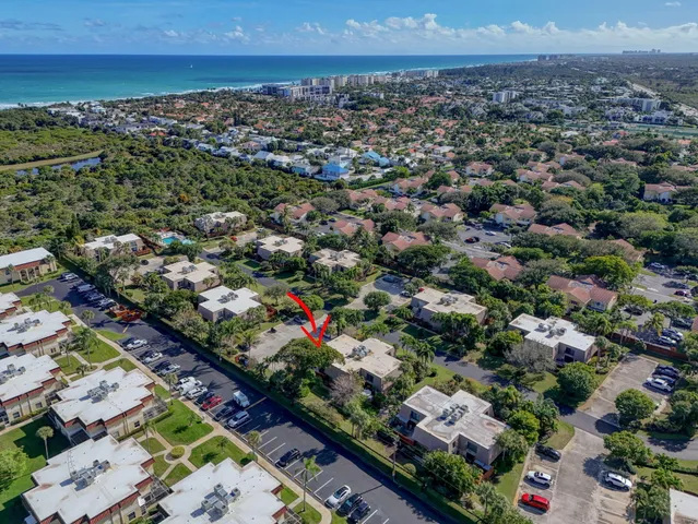 a kitchen with stainless steel appliances granite countertop a dining table and chairs