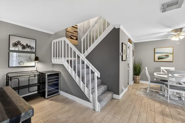 a view of a garden with plants and large trees