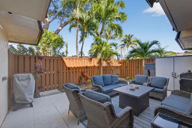 a kitchen with appliances a sink and cabinets