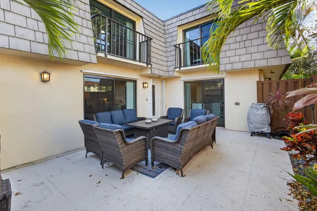 a bathroom with a granite countertop sink a mirror and shower