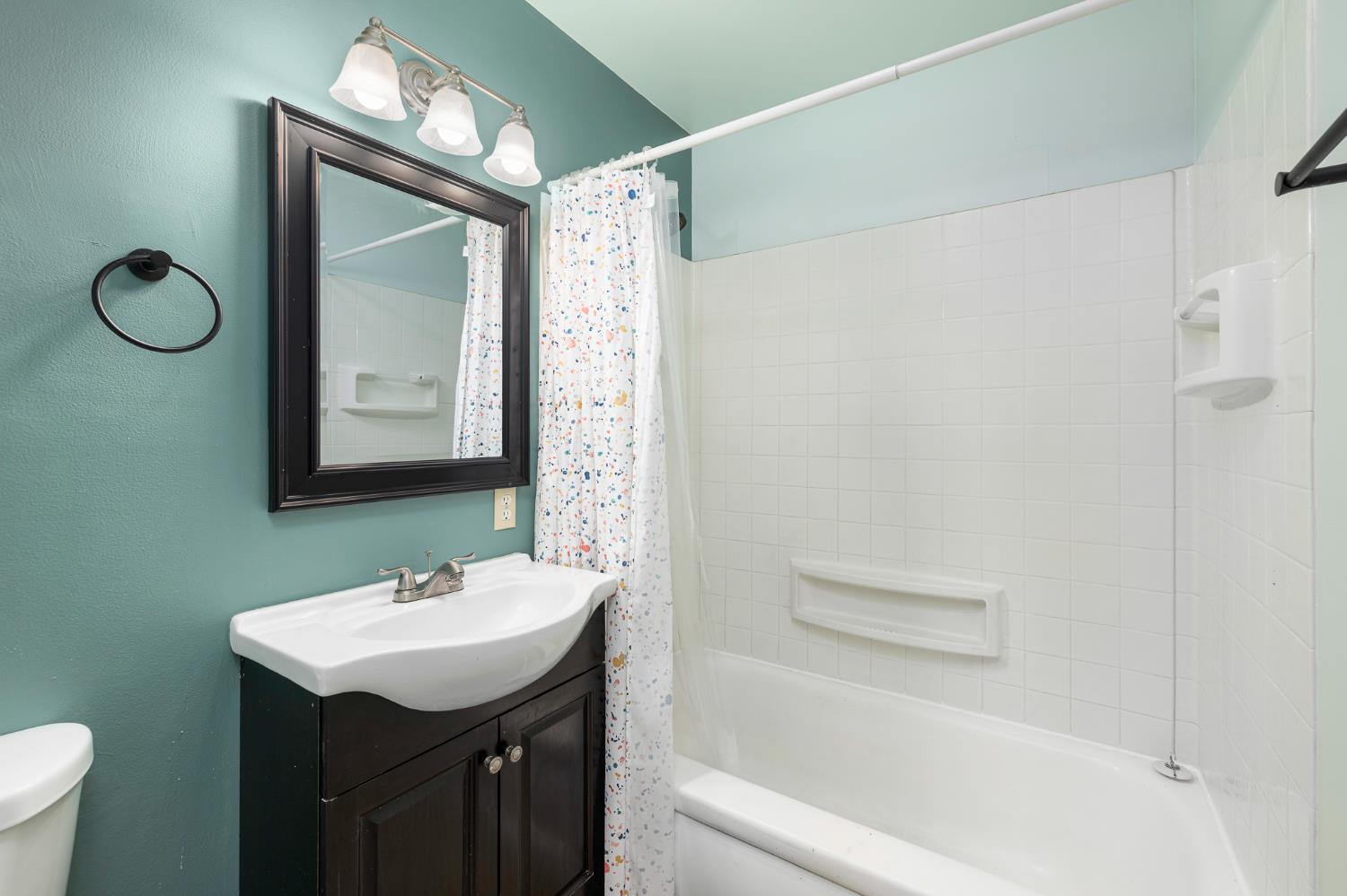 3310 East Hampton Way Fresno, CA 93726 - Photo 14 of 20 a bathroom with a sink a toilet and shower