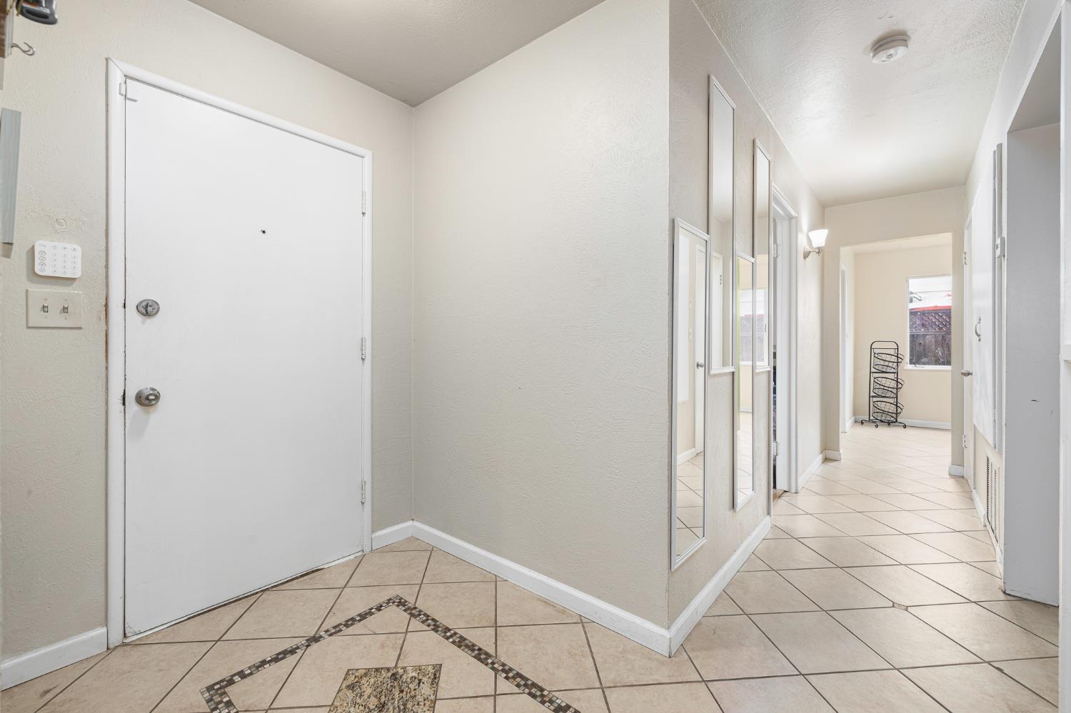 3310 East Hampton Way Fresno, CA 93726 - Photo 2 of 20 a view of a hallway