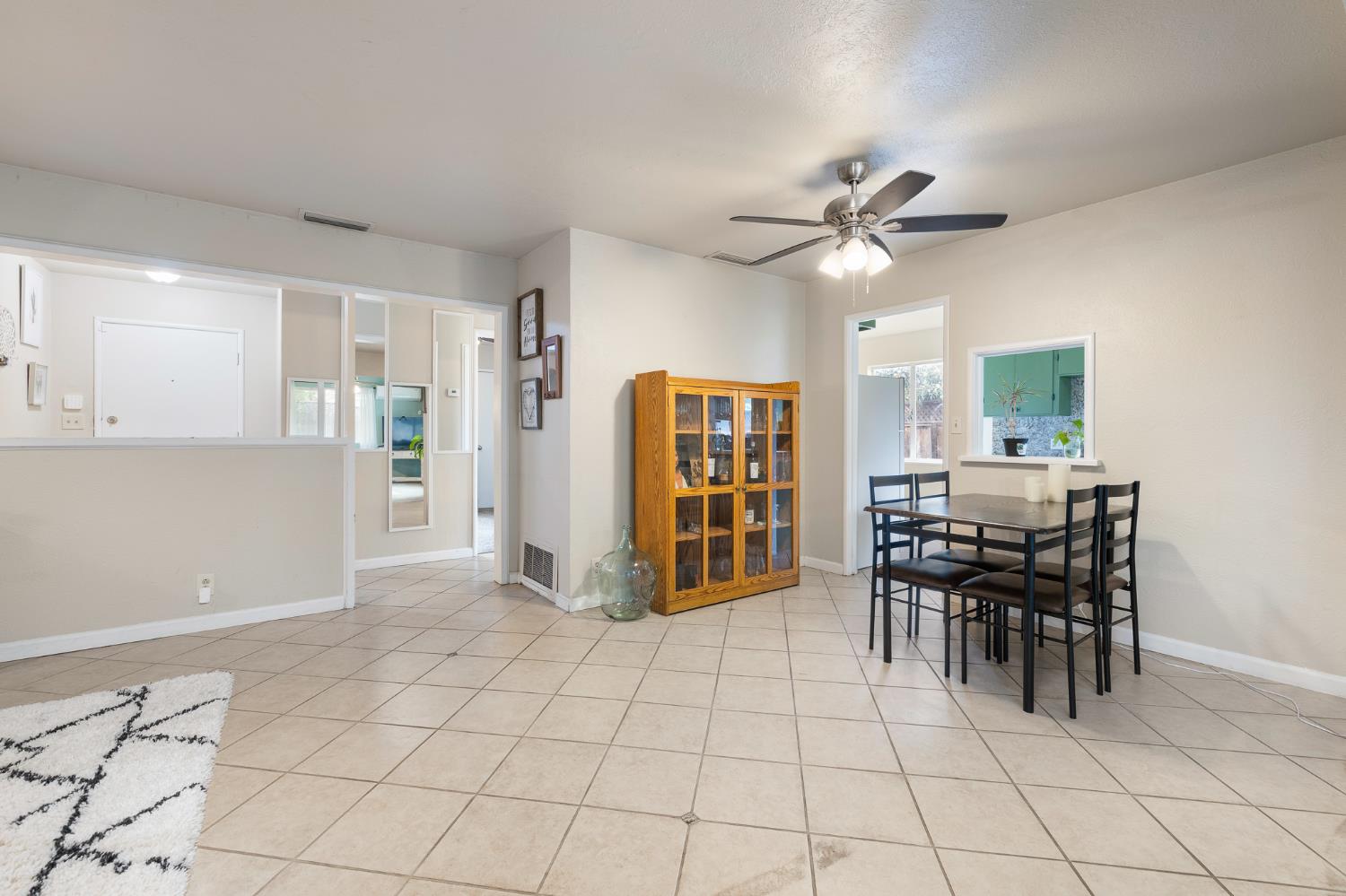 3310 East Hampton Way Fresno, CA 93726 - Photo 6 of 20 a view of a dining room with furniture