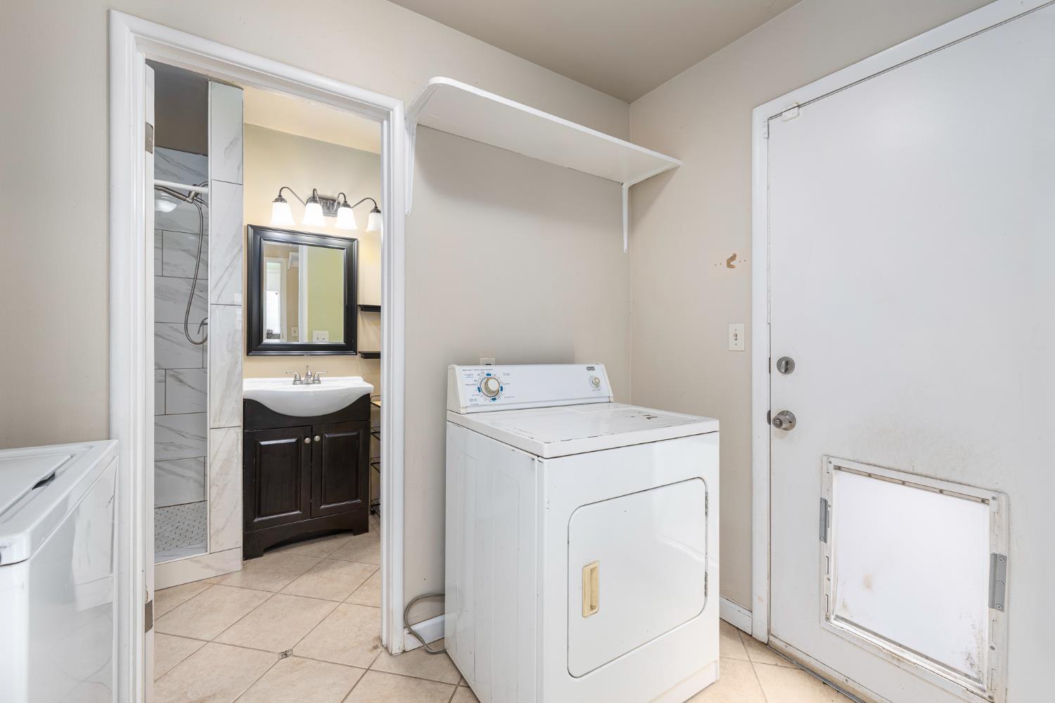 3310 East Hampton Way Fresno, CA 93726 - Photo 10 of 20 a view of bathroom with a washer and dryer