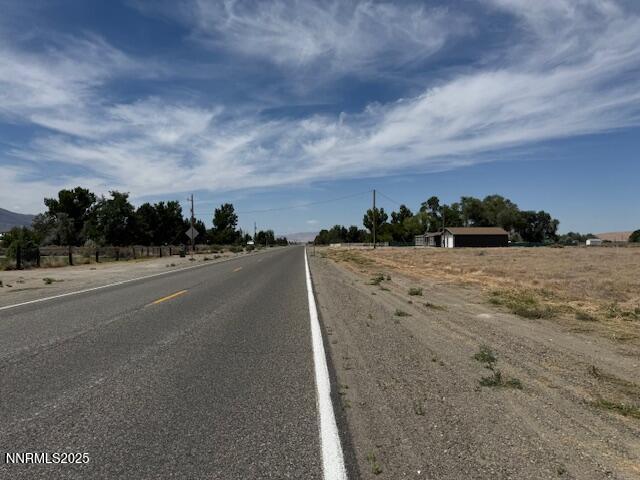 7225 West Rose Creek Road Winnemucca, NV 89445 - Photo 7 of 8 a view of a road with a big yard