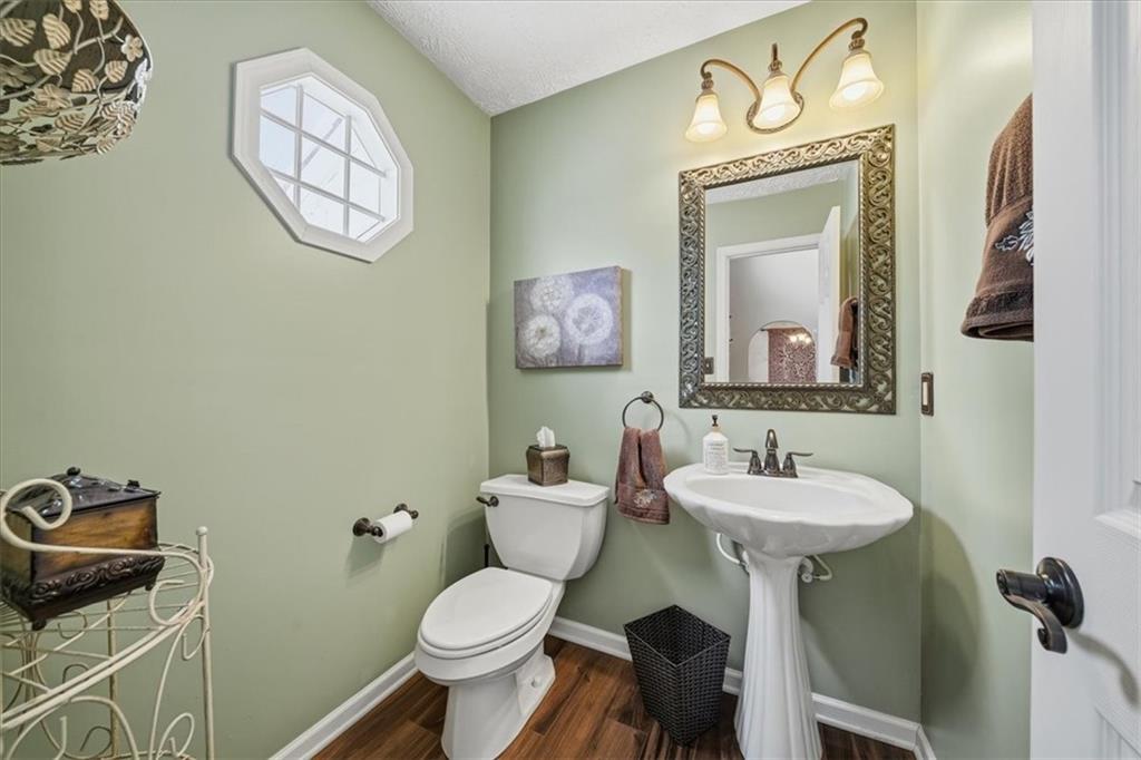 140 Cedar Ridge Drive Monaca, PA 15061 - Photo 12 of 32 a bathroom with a toilet a sink and mirror
