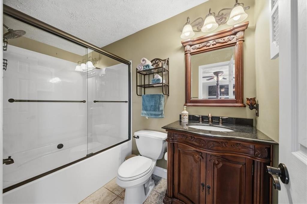 140 Cedar Ridge Drive Monaca, PA 15061 - Photo 15 of 32 a bathroom with a sink a toilet and shower
