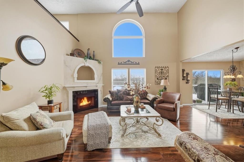 140 Cedar Ridge Drive Monaca, PA 15061 - Photo 6 of 32 a living room with furniture a fireplace and wooden floor