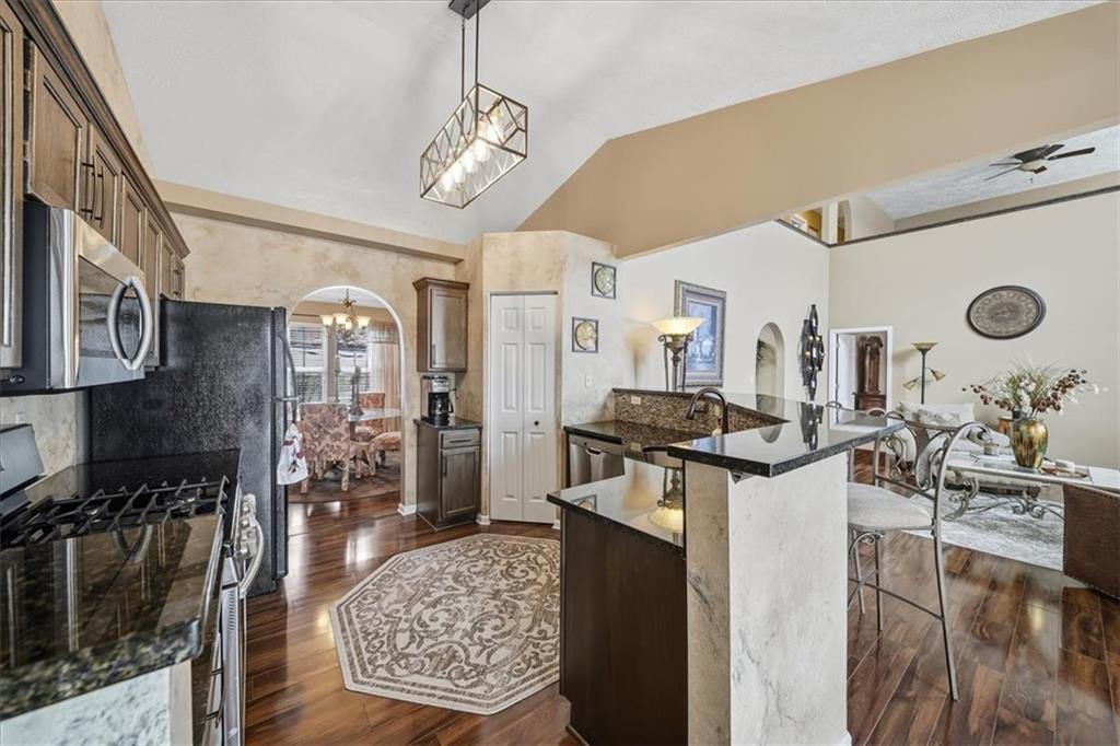 140 Cedar Ridge Drive Monaca, PA 15061 - Photo 9 of 32 a kitchen with stainless steel appliances granite countertop a stove and cabinets