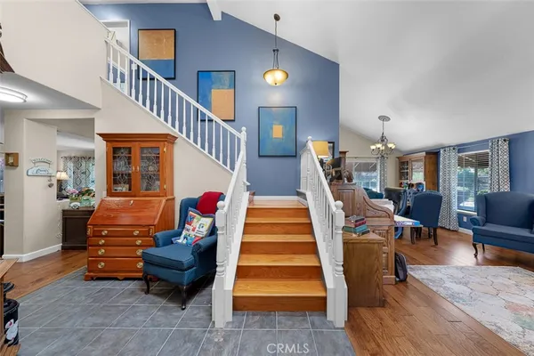 a kitchen with stainless steel appliances kitchen island granite countertop a stove refrigerator and cabinets