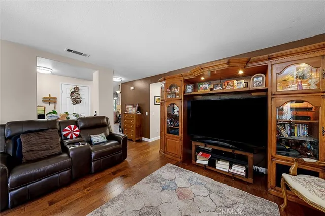 a bedroom with a bed and a television