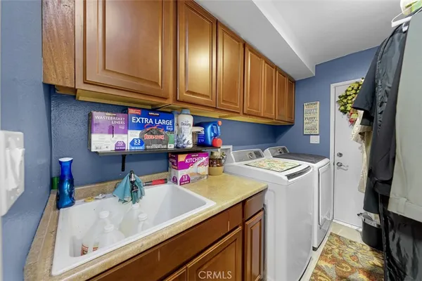 a view of a backyard with plants and a patio
