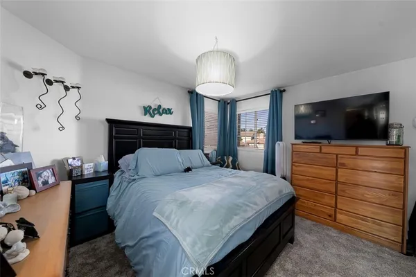 a view of a house with yard and sitting area