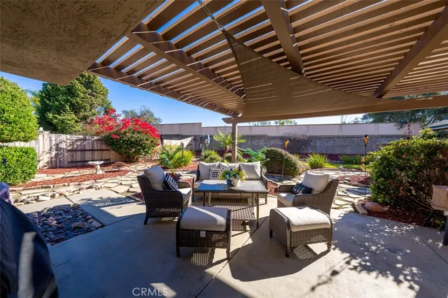 a view of a backyard with sitting area