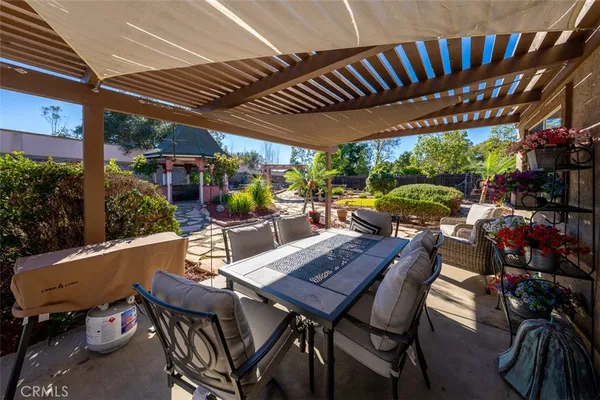 a view of a backyard with sitting area