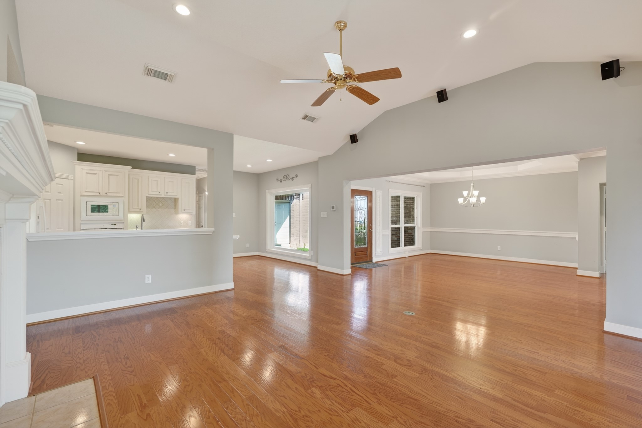 20714 Flora View Court Spring, TX 77379 - Photo 15 of 40 a view of an empty room with window and wooden floor