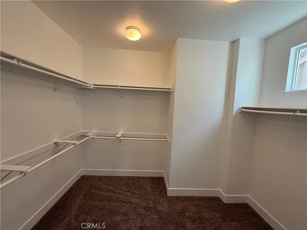 a view of an empty walk in closet