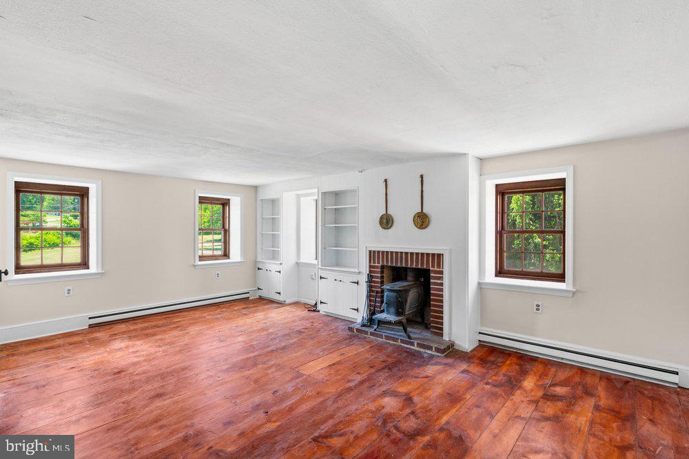 201 East Moyer Road Pottstown, PA 19464 - Photo 39 of 64 an empty room with windows and fireplace