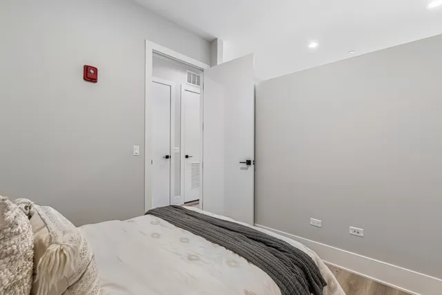 a bedroom with a bed and a cabinets