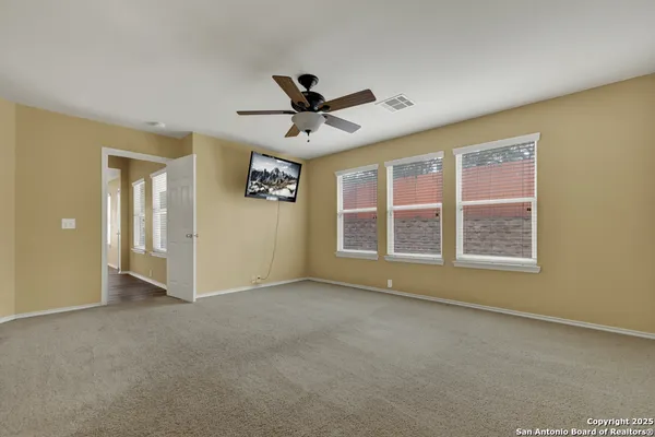 a view of an empty room with a window