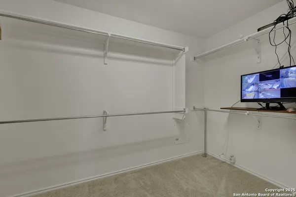 a view of an empty walk in closet