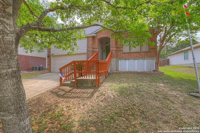 a wooden bench sitting in middle of a yard