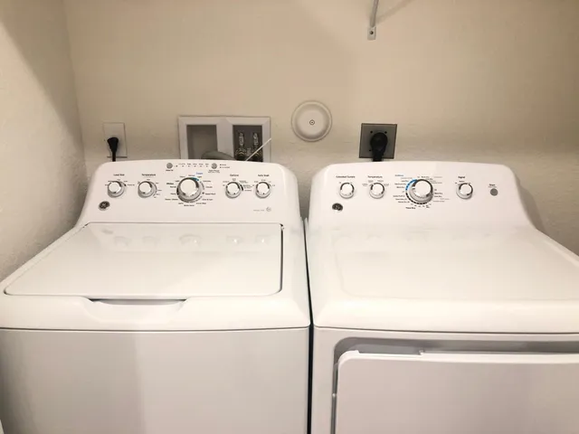 a kitchen with a refrigerator sink and microwave
