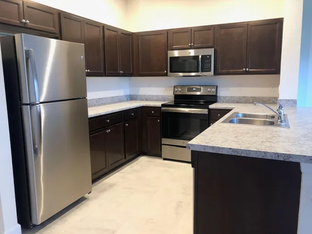 a view of a lake with houses in the back