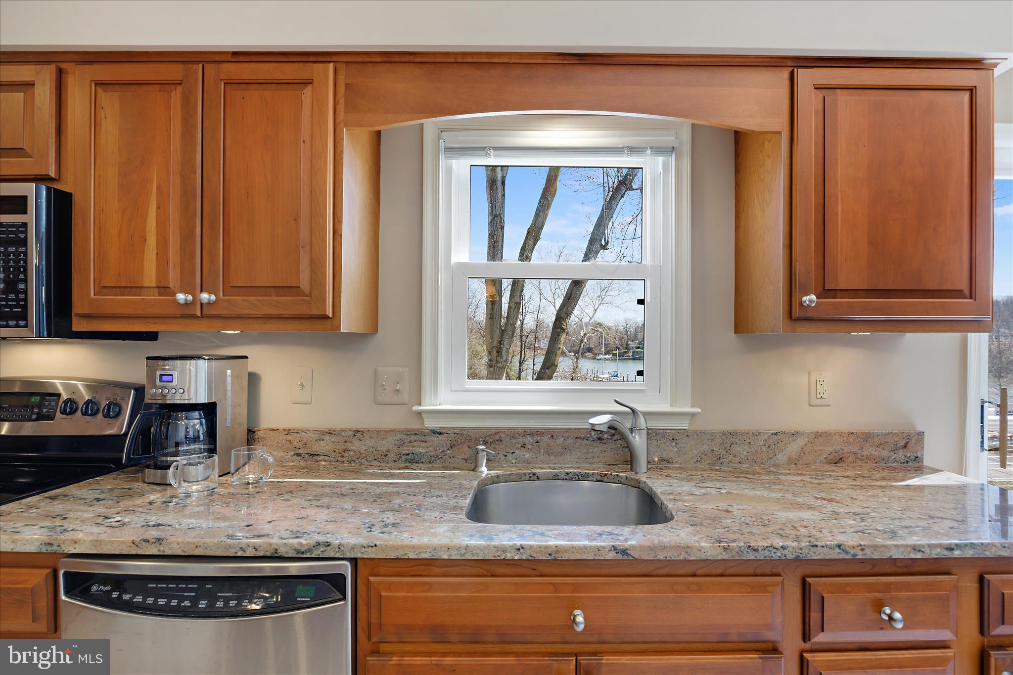 253 Milthorn Court Riva, MD 21140 - Photo 17 of 71 a kitchen with granite countertop stainless steel appliances granite countertop a sink dishwasher a refrigerator and cabinets with wooden floor