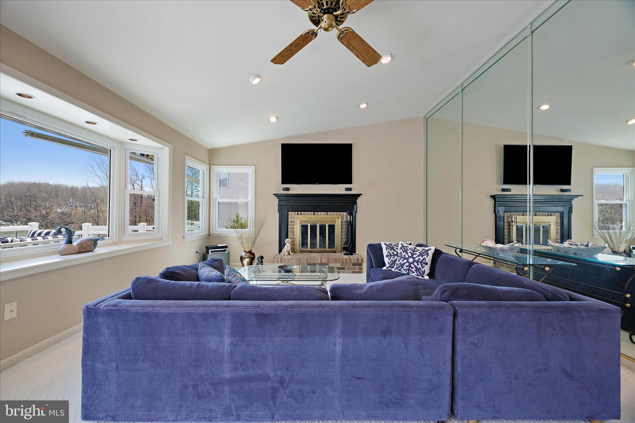 253 Milthorn Court Riva, MD 21140 - Photo 27 of 71 a living room with fireplace furniture and a flat screen tv